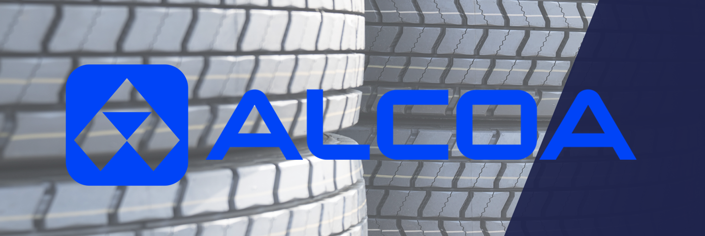 Blue Alcoa logo on a background of black tyres