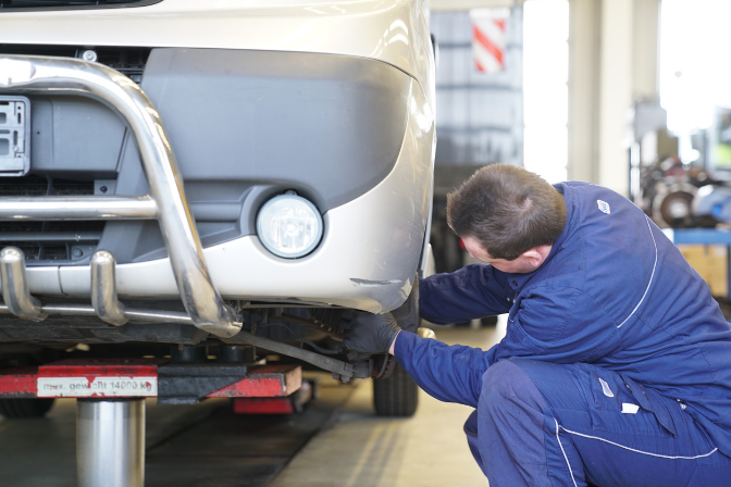 A mechanic from BAS performing an alignment